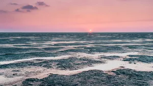 Tranquil beach sunset over tropical paradise island