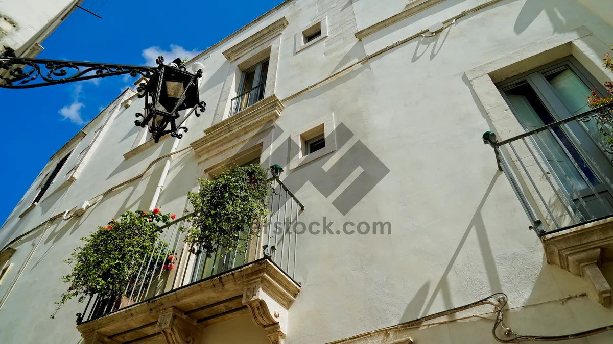 Picture of Ancient Stucco Home in Urban City Skyline