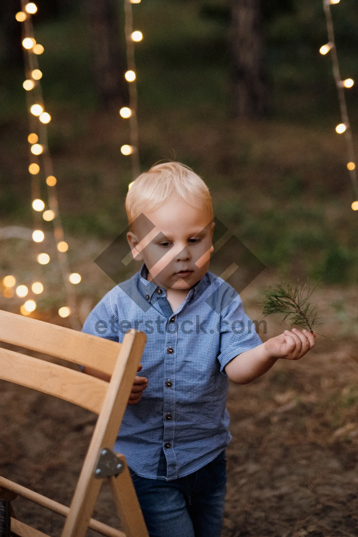 Picture of Happy child playing on swing in park.