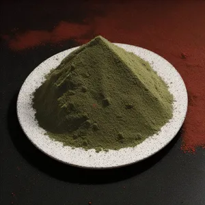 Brown bread and tea powder on breakfast table.