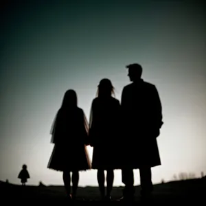 Black silhouette of a business team cheering newlywed bride