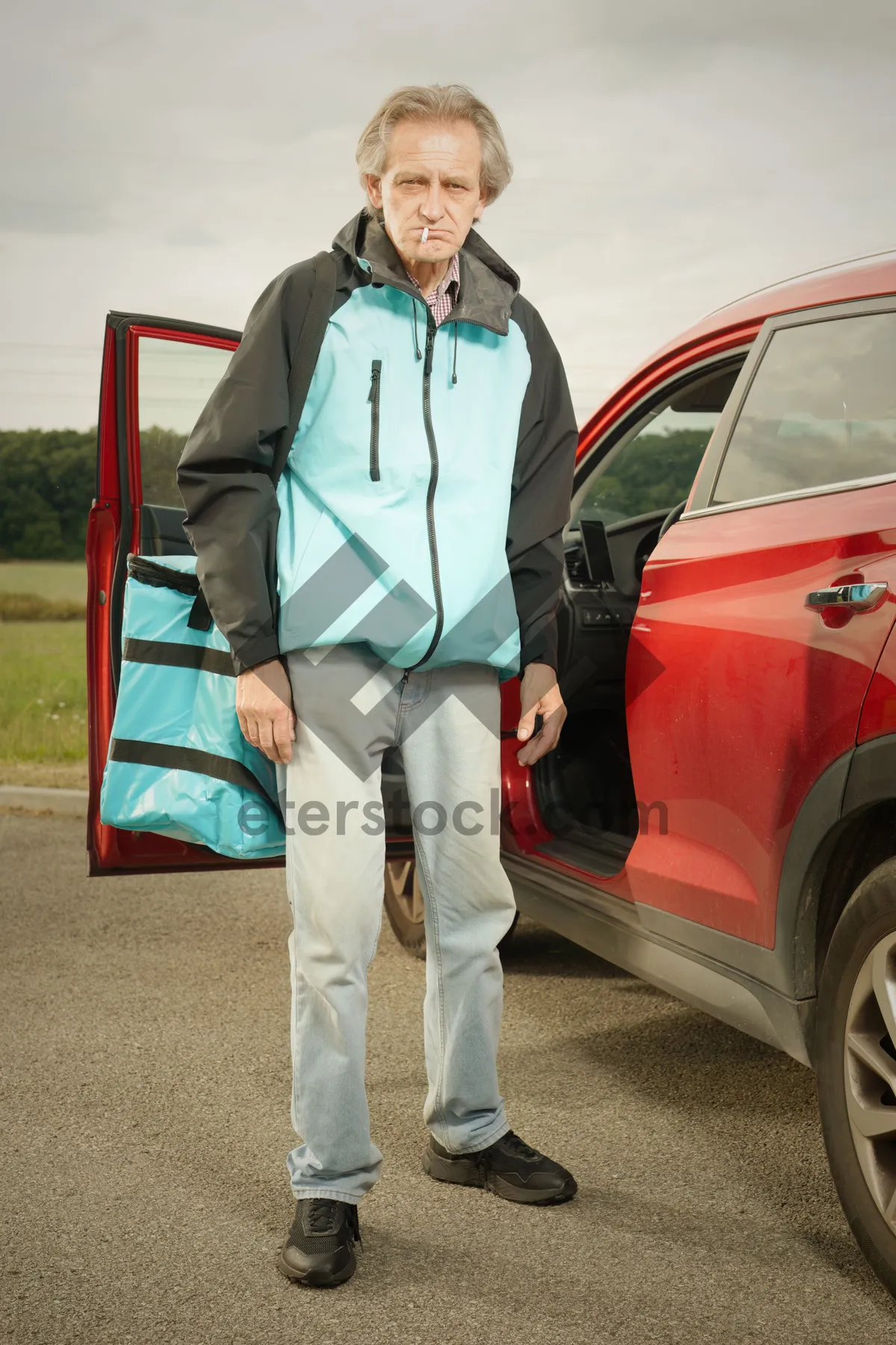 Picture of Man driving a minivan on the road