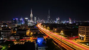 Modern skyline with suspension bridge at night