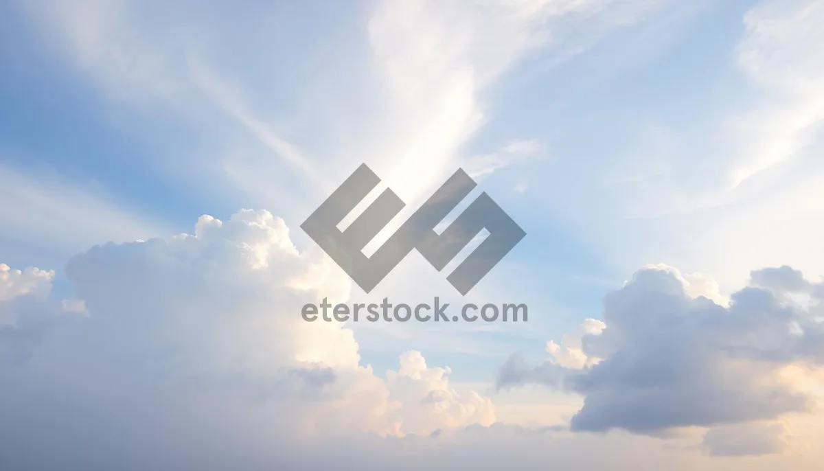 Picture of Clear summer sky with fluffy clouds and bright sun