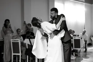 Happy groom and bride posing at wedding.