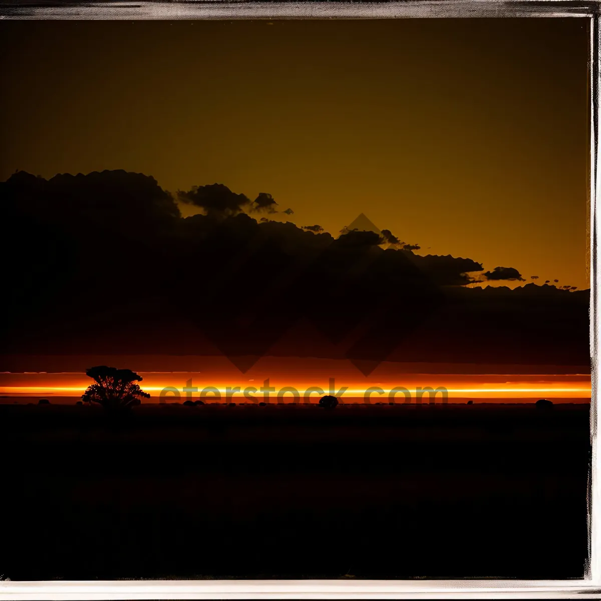 Picture of Vibrant Sunset Sky over Tranquil Ocean