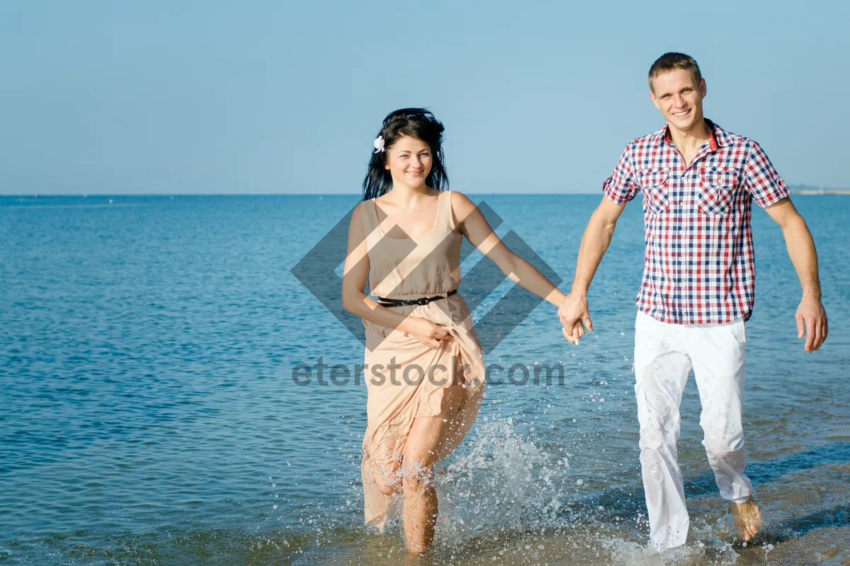 Picture of Happy couple enjoying beach vacation in tropical paradise