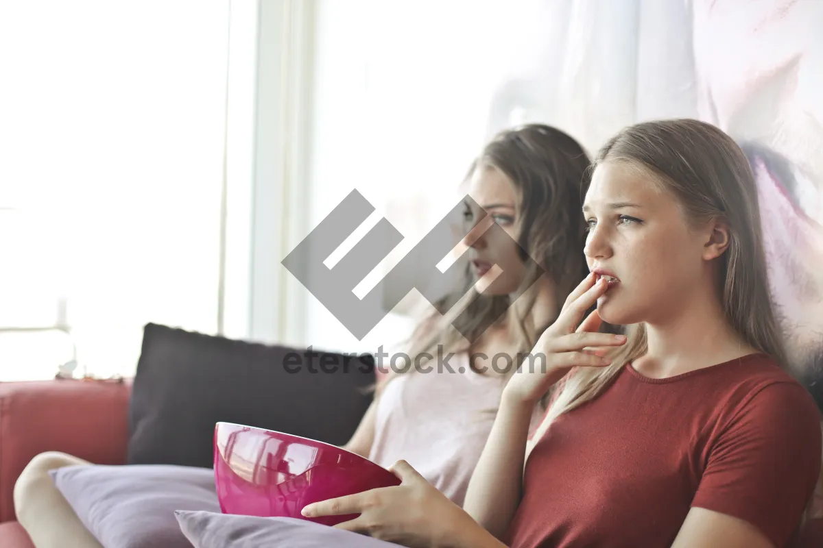 Picture of Smiling couple working on laptop at home