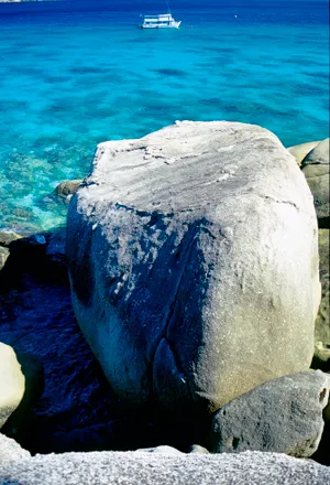 Tropical island beach with coral and sea turtle. The colors and crystal clear water of the archipelago of the Similan Islands National Park, Thailand, Asia