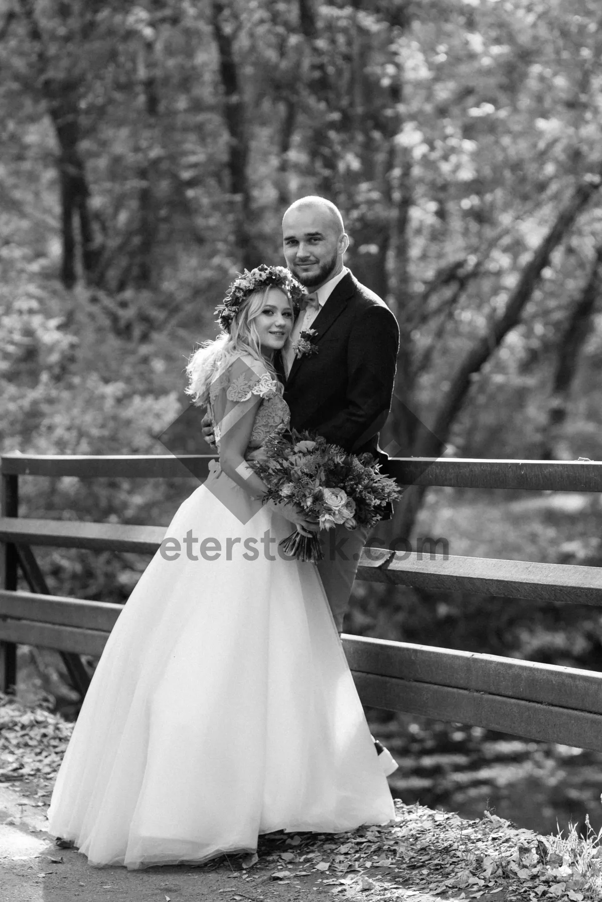 Picture of Joyful wedding couple surrounded by flowers and love