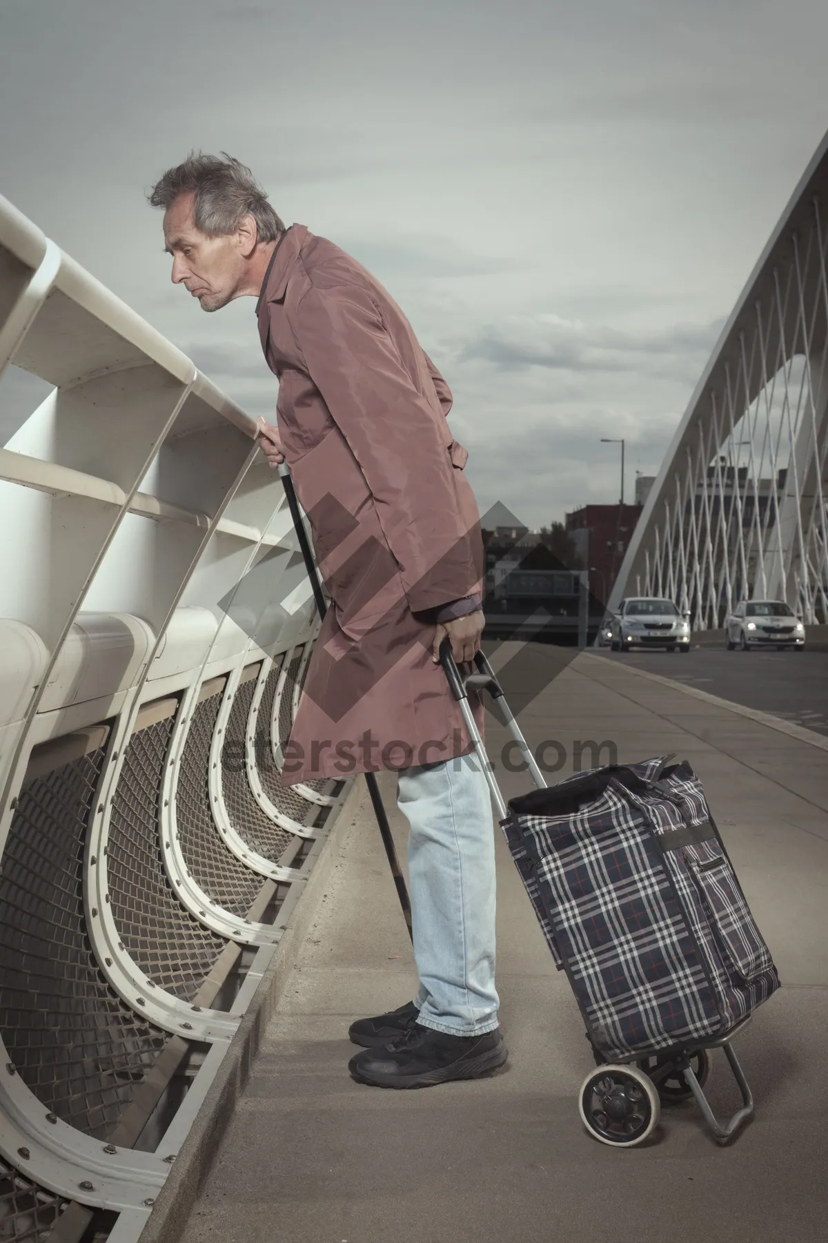 Picture of Adult businessman with crutch standing confidently