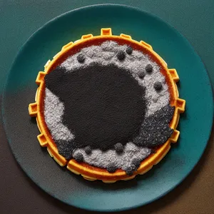 Black coffee filter on frying pan with sugar