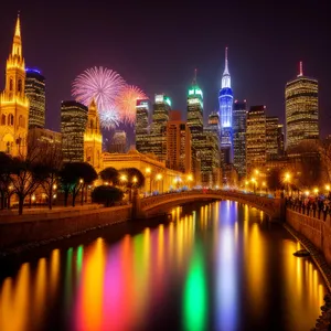 Illuminated city skyline over waterfront river