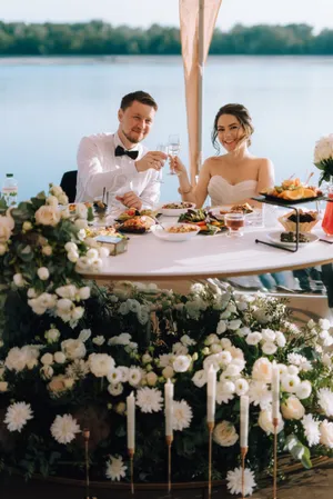 Happy wedding couple celebrating their special day outdoors.