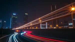 Fast-paced city traffic at night on expressway.