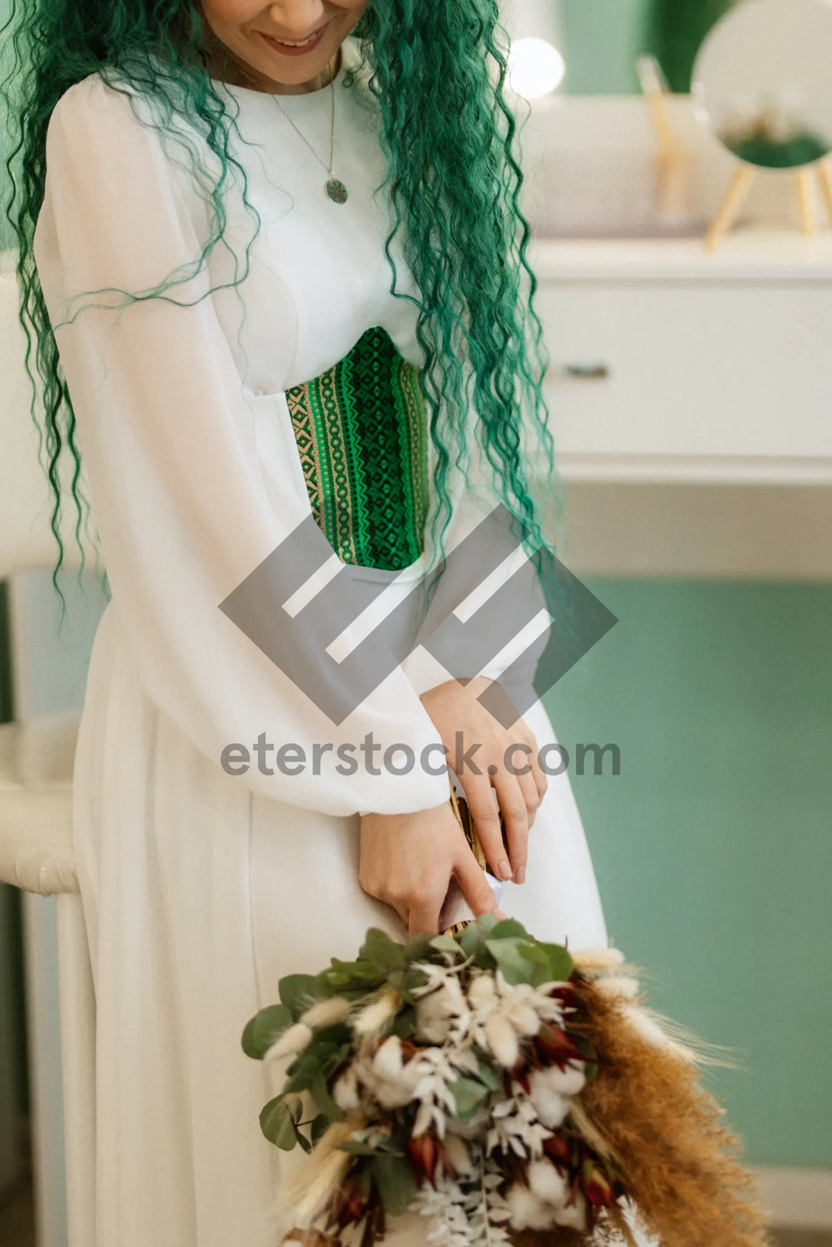 Picture of Bride with bouquet of flowers on wedding day