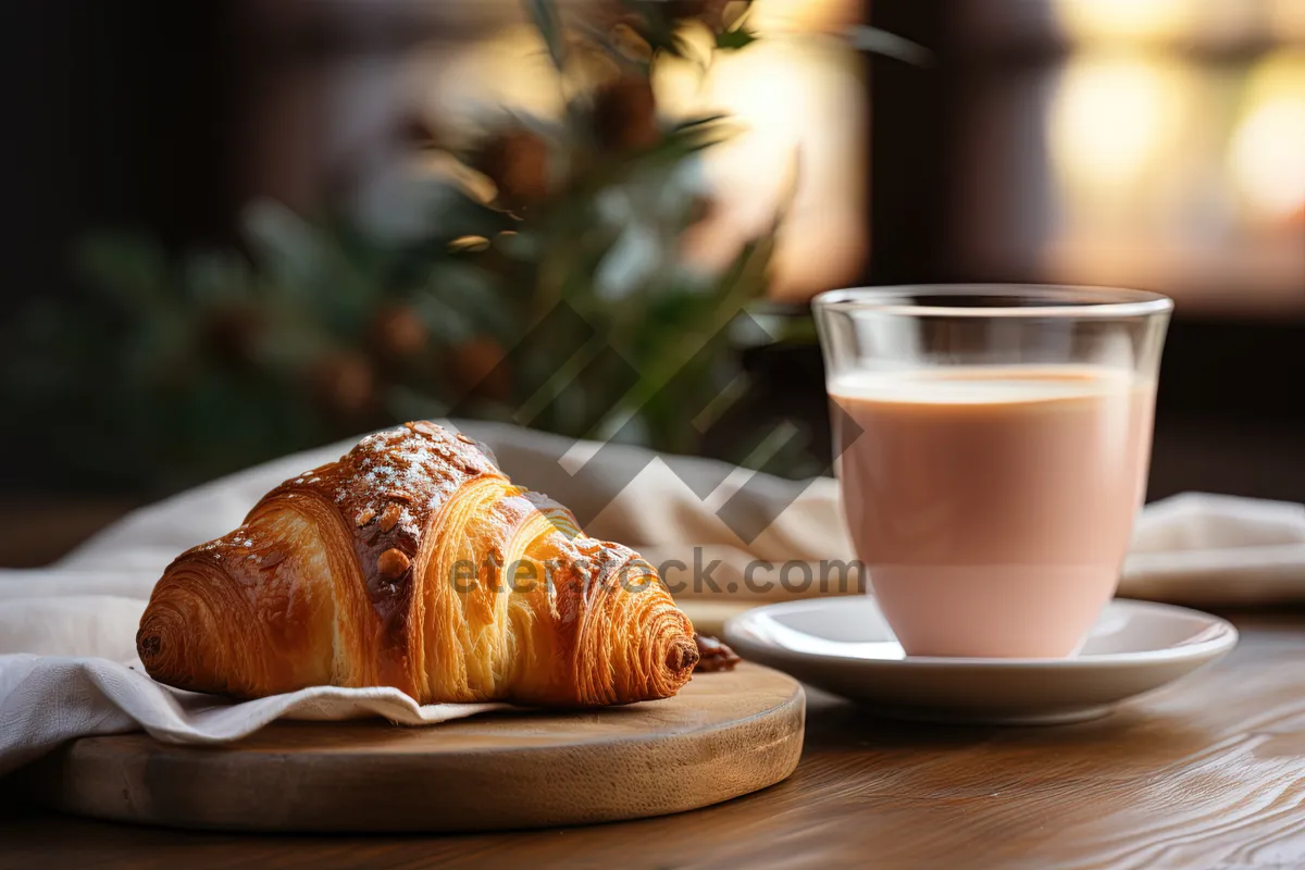 Picture of Delicious breakfast pastry and coffee on table.