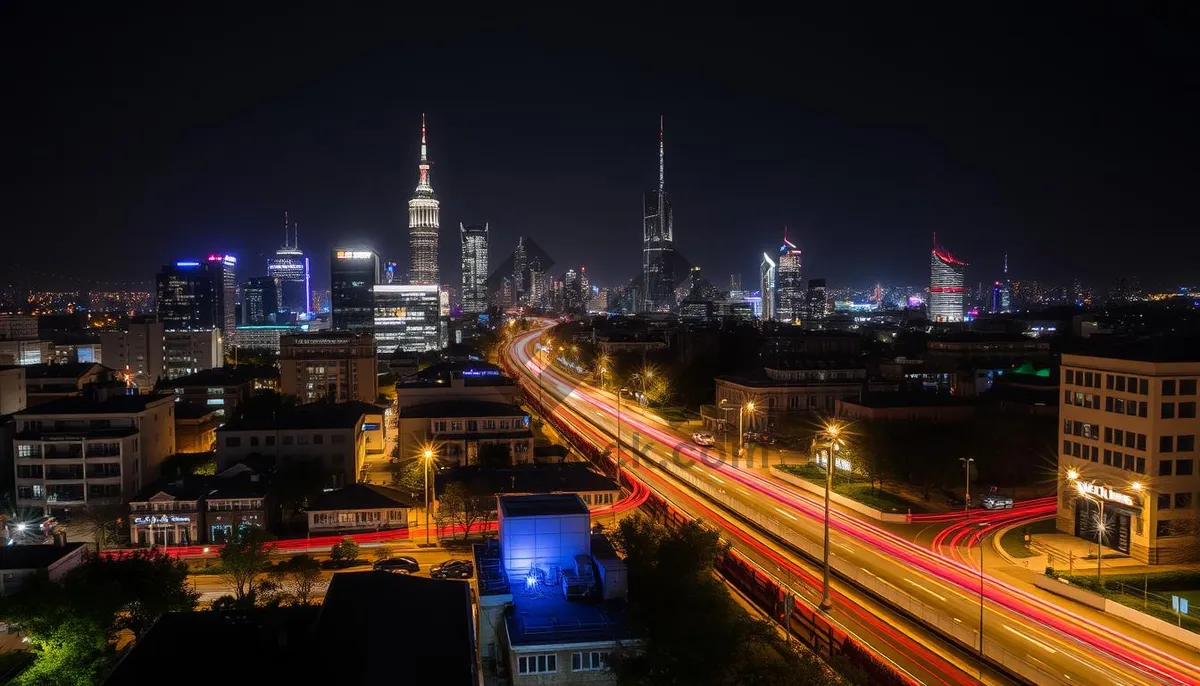 Picture of Modern skyline with suspension bridge at night