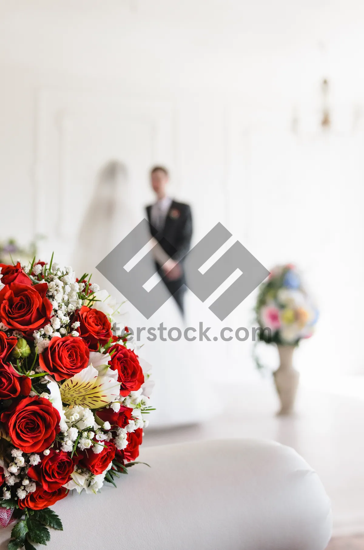 Picture of Attractive happy bride with bouquet of roses