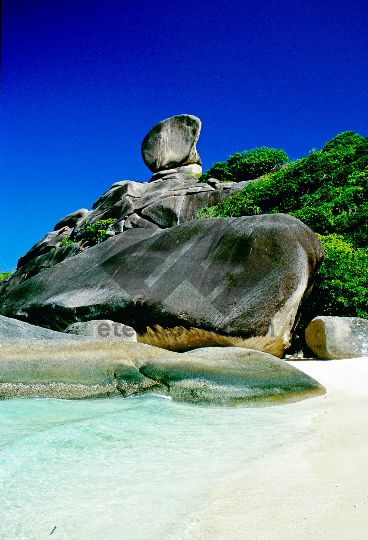 Picture of Rocky landscape with turtle statue by the water. The colors and crystal clear water of the archipelago of the Similan Islands National Park, Thailand, Asia