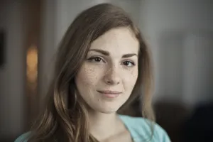 Attractive brunette lady with a happy smile portrait.