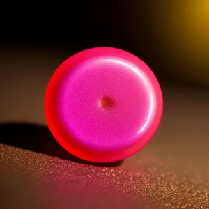 Shiny orange button with glass reflection.