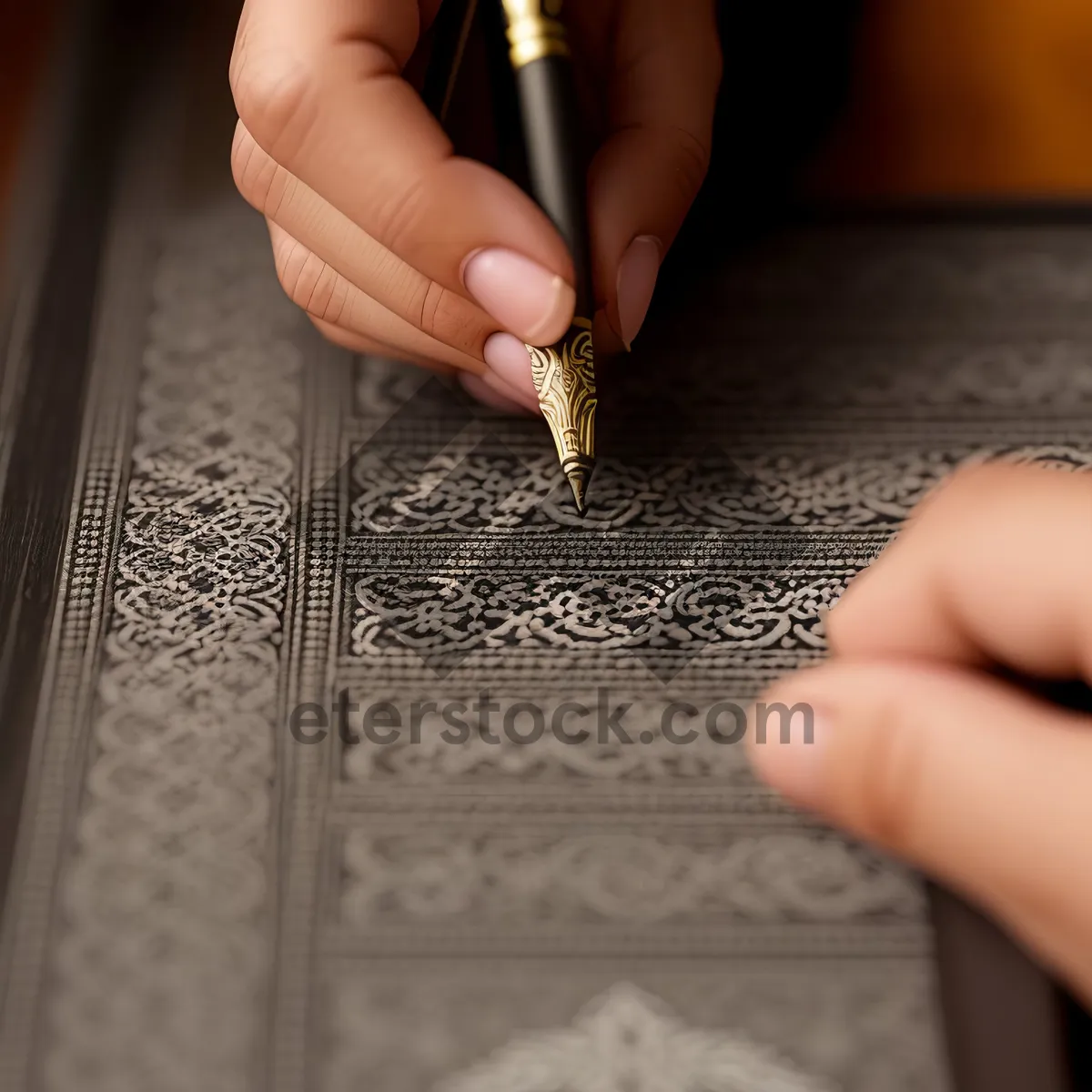 Picture of Hand holding pen writing on puzzle paper