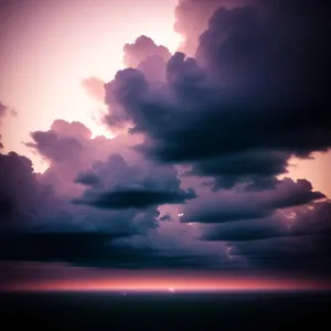 Glorious Sun Setting Behind Majestic Clouds