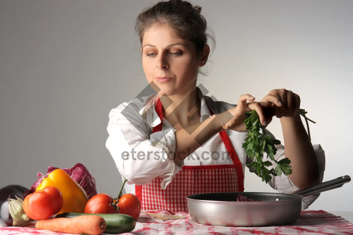 Picture of Happy couple cooking meal in stylish kitchen.