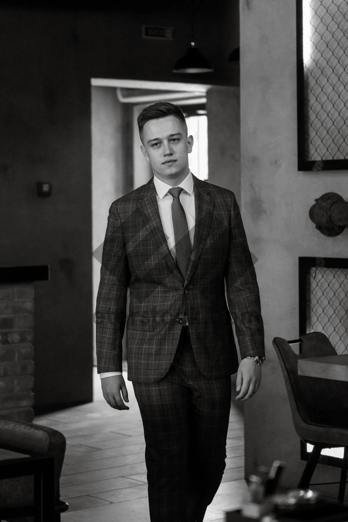 Picture of Confident businessman standing in office