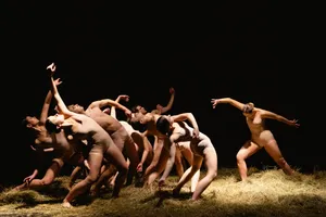 Sexy male dancer performing on stage.