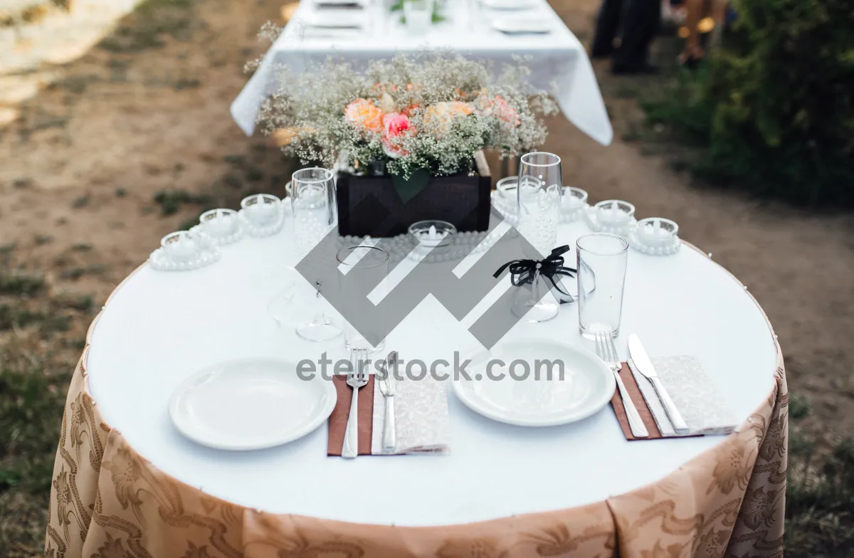 Picture of Luxurious dinner table setting with elegant glassware