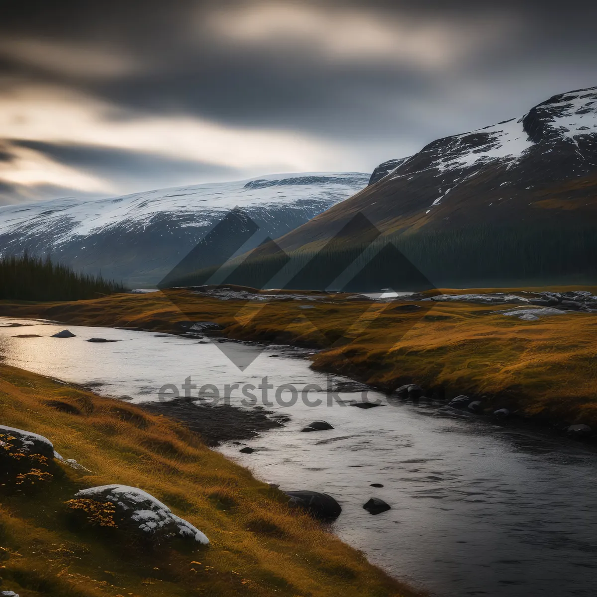 Picture of Rocky coast at sunset with snowy mountain view.
