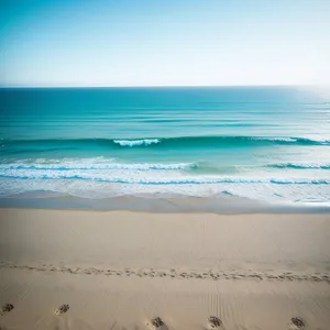 Tranquil Beachscape: Sunny Shore and Turquoise Waves