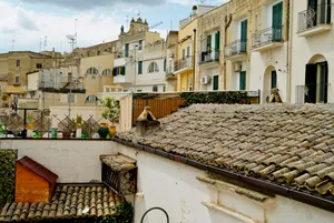 Ancient Tile Roofed Church in Historic City Skyline