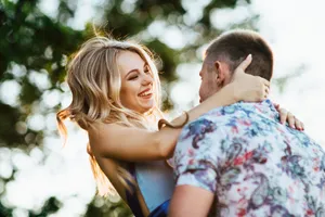 Happy couple in park enjoying summer together