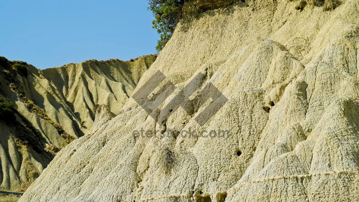 Picture of Rocky Canyon Skyline Landscape with Thatched Roof Hut