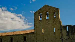 Historic stone church tower in medieval town.