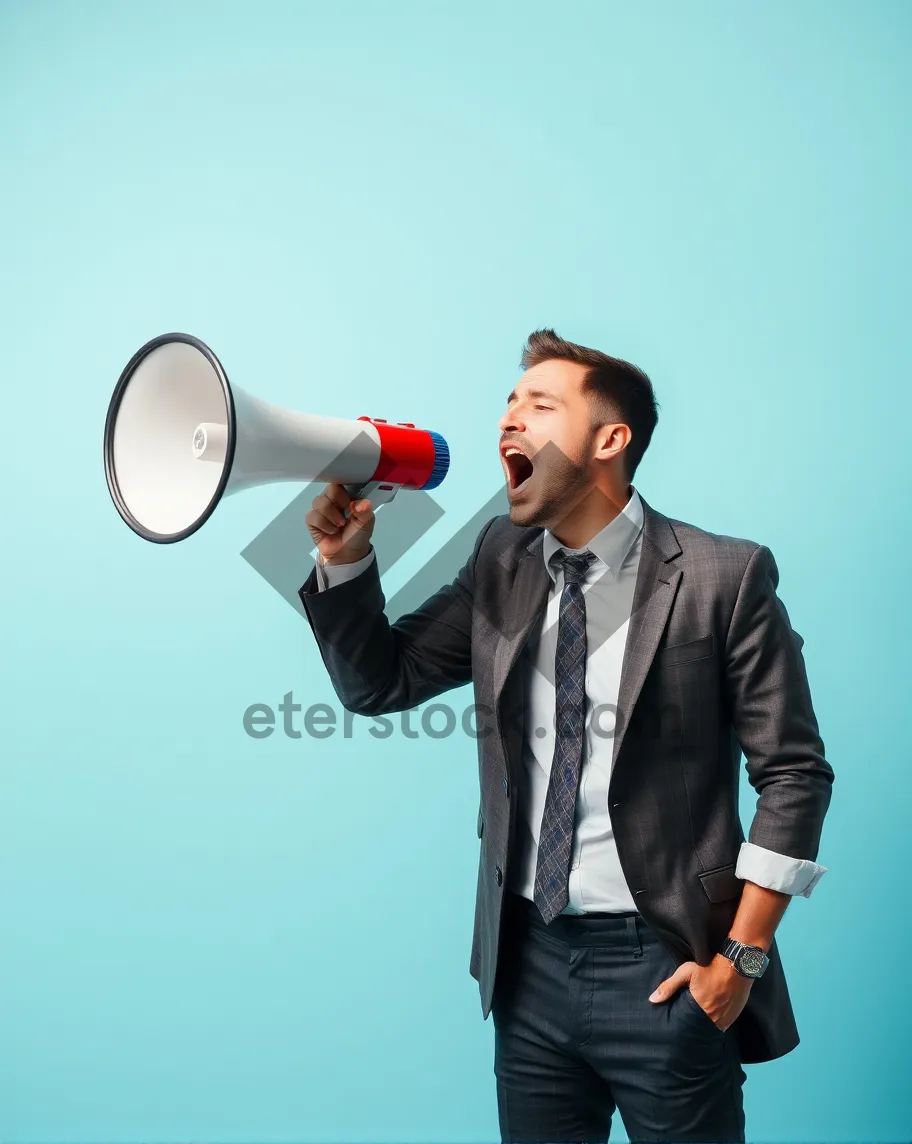 Picture of Attractive professional businesswoman holding a megaphone in suit