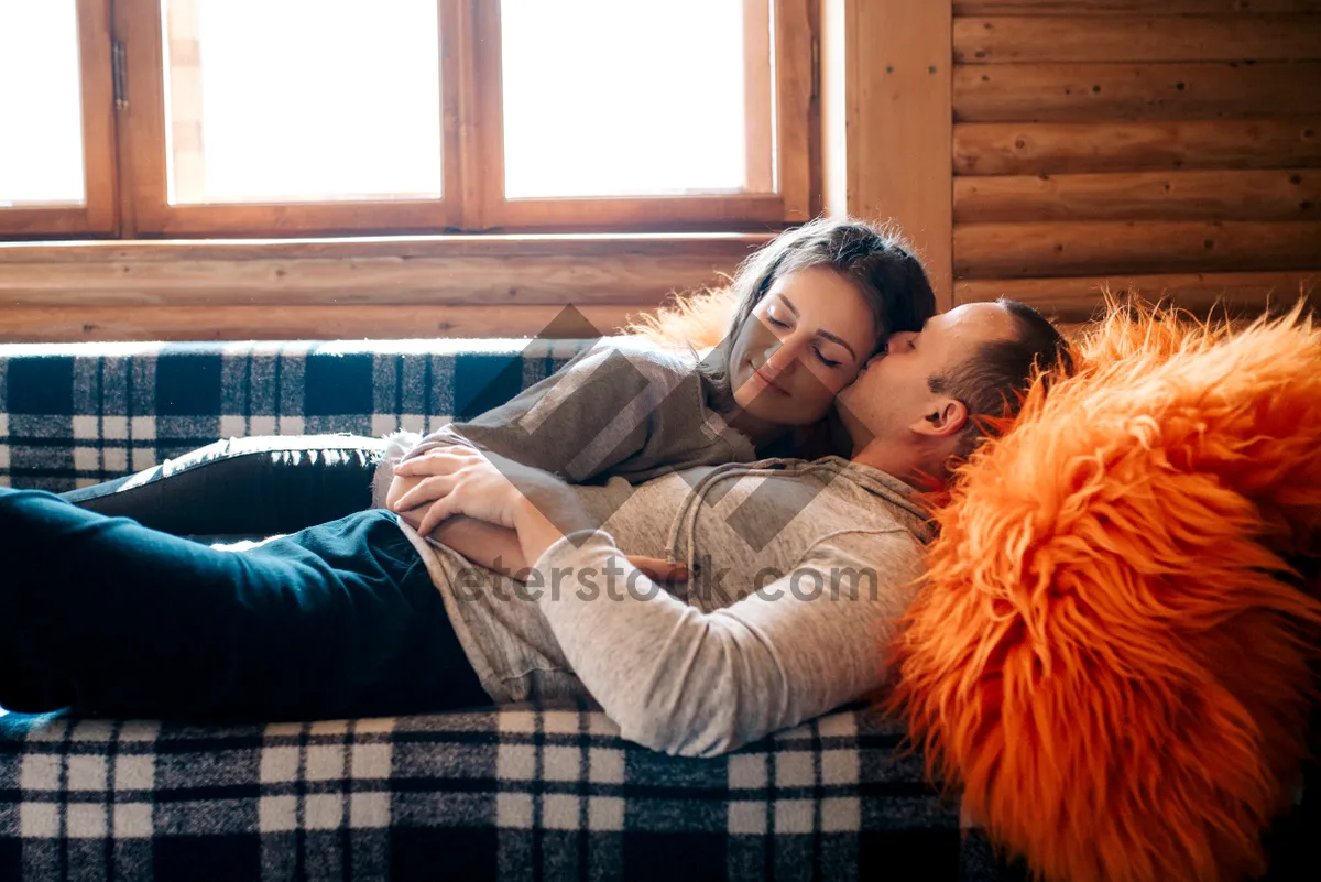 Picture of Happy family relaxing on convertible sofa at home