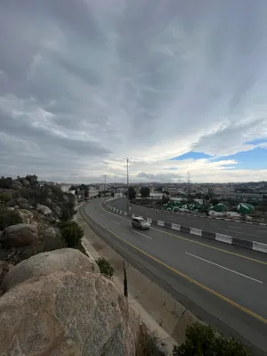 Mountain highway road trip with cloudy sky landscape view