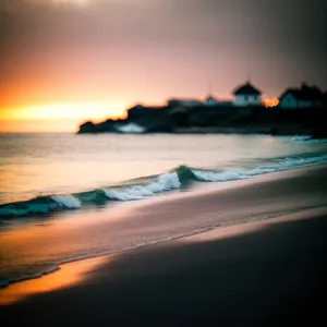 Golden Sunset Reflection on Tranquil Ocean Shore