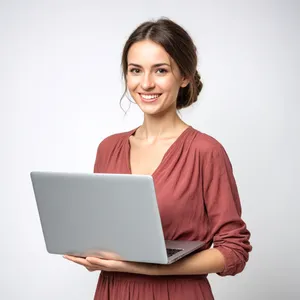 Smiling businesswoman working on laptop in office