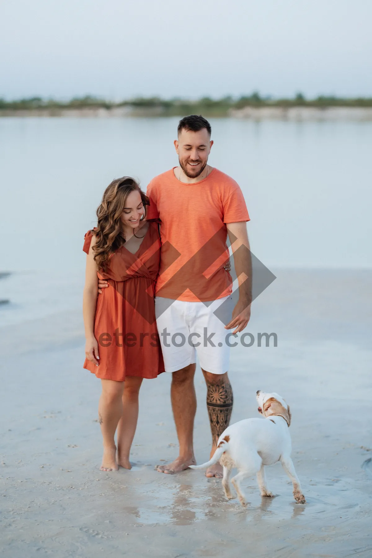 Picture of Happy family walking on the beach during vacation