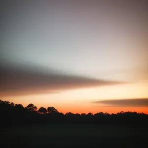 Golden Horizon: Majestic Sunset Amongst Mountain Silhouette