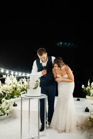 Happy couple celebrates wedding day outdoors with flowers