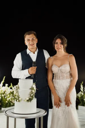 Happy bride and groom outdoors with flowers