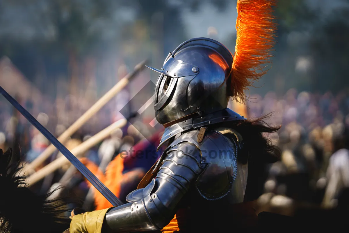 Picture of Male warrior with shield and sword in historical armor.