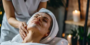 Attractive woman smiling during spa massage treatment