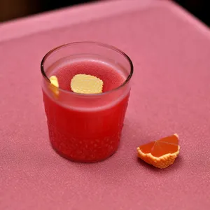 Refreshing strawberry yogurt drink in glass with ice